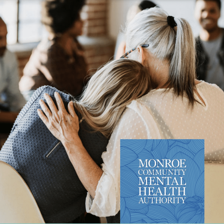 Two woman hugging with Monroe Community Mental Health Authority logo and graphic in lower right corner