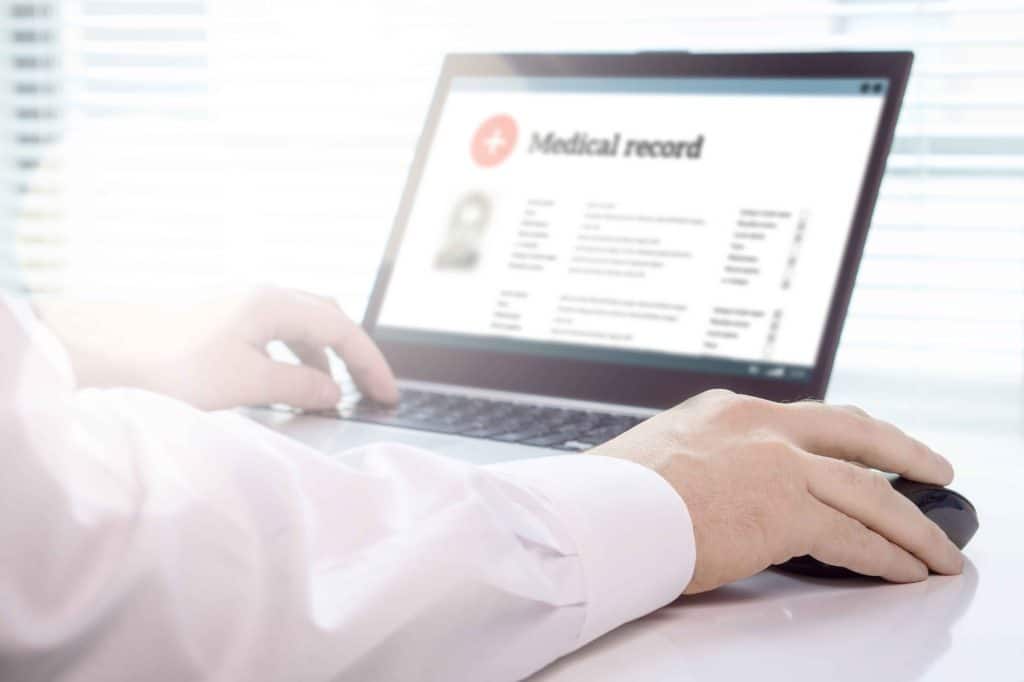 Close up of laptop with medical record on screen